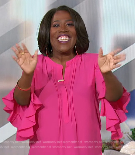 Sheryl's pink ruffle sleeve blouse on The Talk