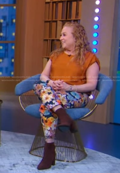 Jodi  Picoult's orange top and floral pants on Good Morning America