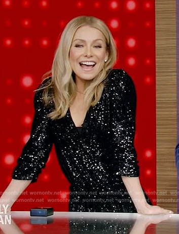 Kelly's black sequin wrap jumpsuit on Live with Kelly and Ryan