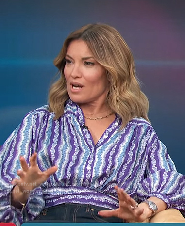 Kit's purple floral striped blouse on Access Hollywood