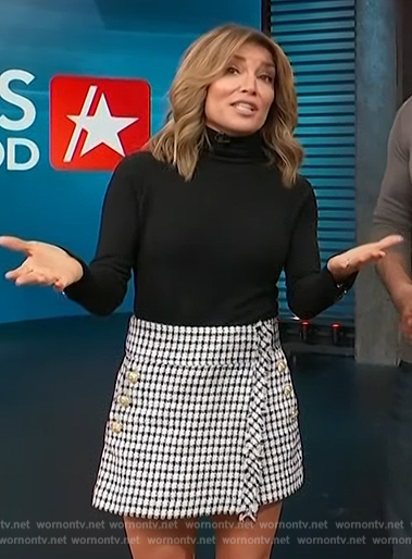 Kit's black sweater and tweed mini skirt on Access Hollywood