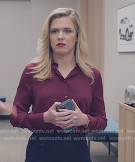 Sadie's maroon blouse on American Auto