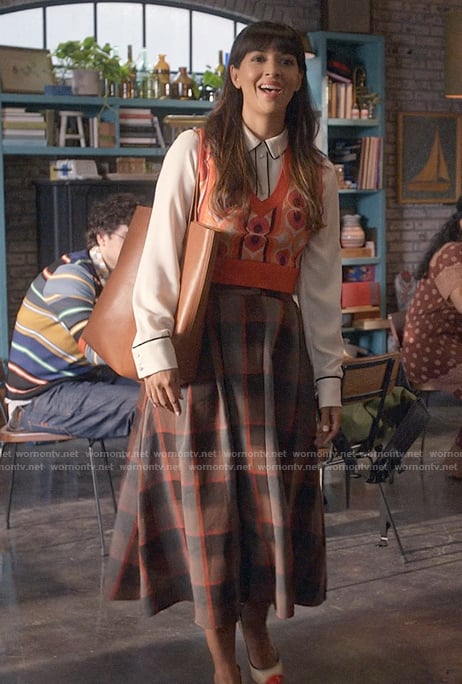 Sam's printed sweater vest and plaid skirt on Not Dead Yet