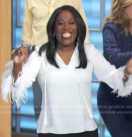 Sheryl's white fringe cuff blouse on The Talk