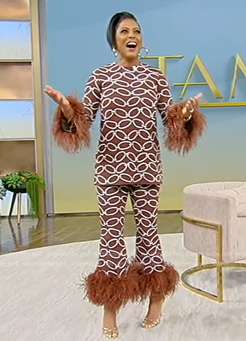 Tamron's brown chain print feather trim top and pants on Tamron Hall Show