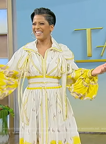 Tamron's yellow printed blouse and skirt on Tamron Hall Show