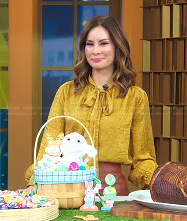 Rebecca's yellow tie neck blouse and brown skirt on Good Morning America