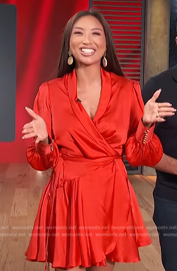 Jeannie Mai's red satin wrap mini dress on Access Hollywood