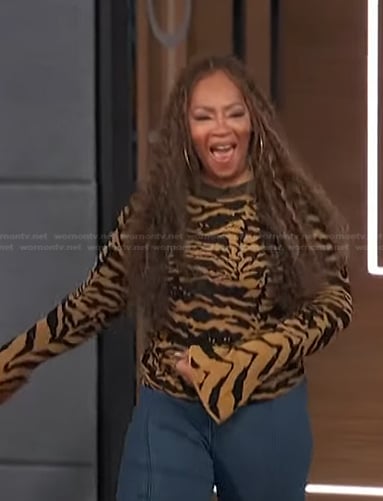 Jody Watley's beige animal print sweater on Access Hollywood