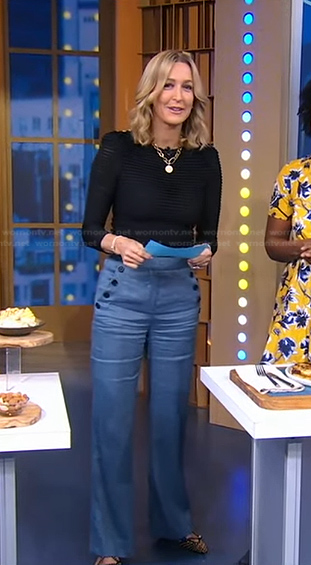 Lara's black ribbed sweater and blue pants on Good Morning America