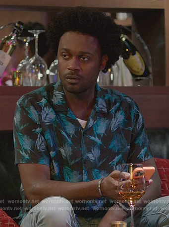 Noah's black leaf print shirt on Grand Crew