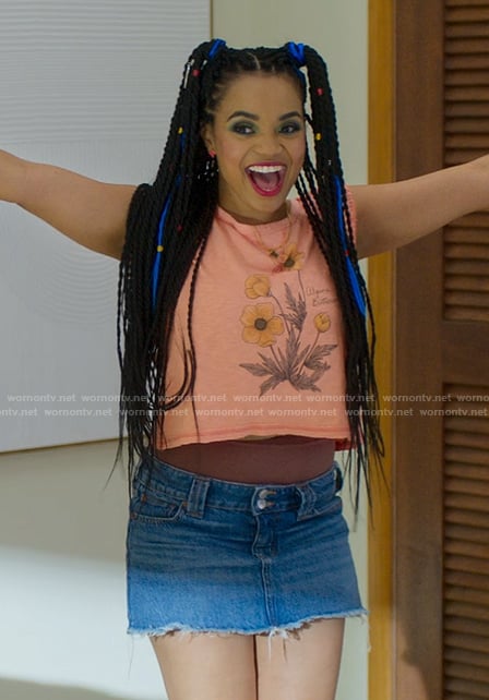 Peaches' orange floral tank top and denim skirt on Fantasy Island