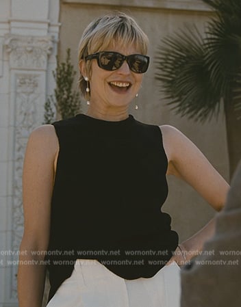 Naomi's black top and sunglasses on Succession