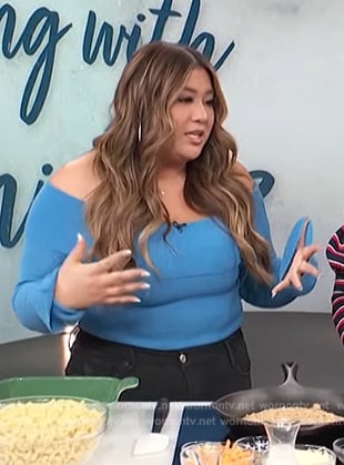 Remi Cruz's blue off shoulder top on Access Hollywood