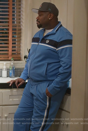 Sherm's blue track jacket and pants on Grand Crew