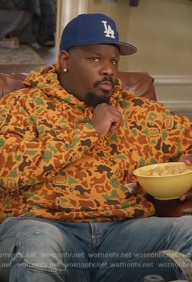 Sherm's yellow printed hoodie on Grand Crew
