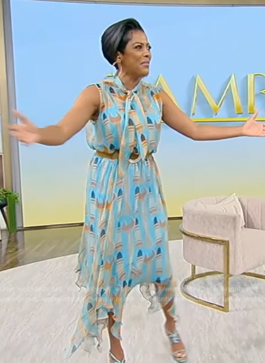 Tamron's blue lipstick print blouse and skirt on Tamron Hall Show
