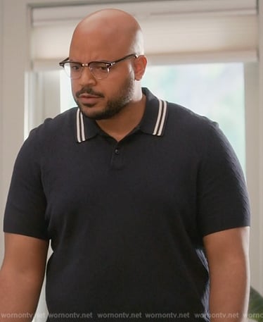 Wyatt's navy textured polo on Grand Crew