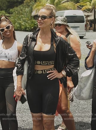 Alexia's black logo trim sports top and biker shorts on The Real Housewives Ultimate Girls Trip