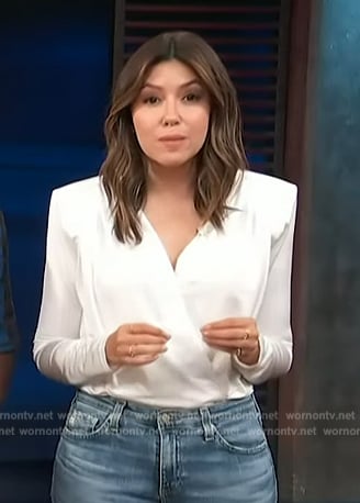 Camille Vasquez's white wrap bodysuit on Access Hollywood