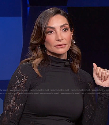 Courtney Lopez's black mesh-sleeve top on E! News