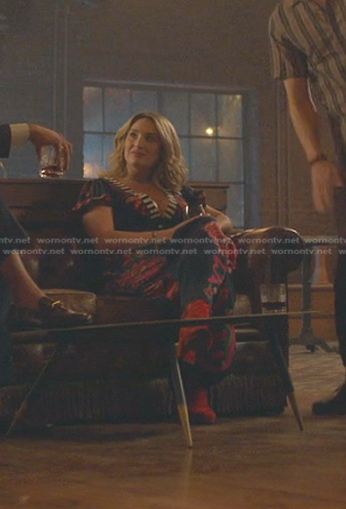 Davia's navy printed v-neck jumpsuit on Good Trouble