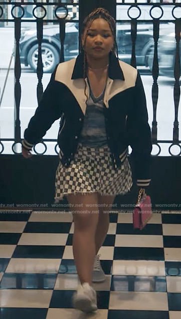 Delilah's checkerboard skirt and two-tone bomber jacket on The Equalizer