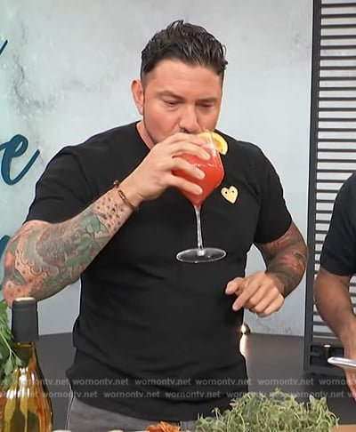 Gabriele Bertaccini's black heart tee on Access Hollywood