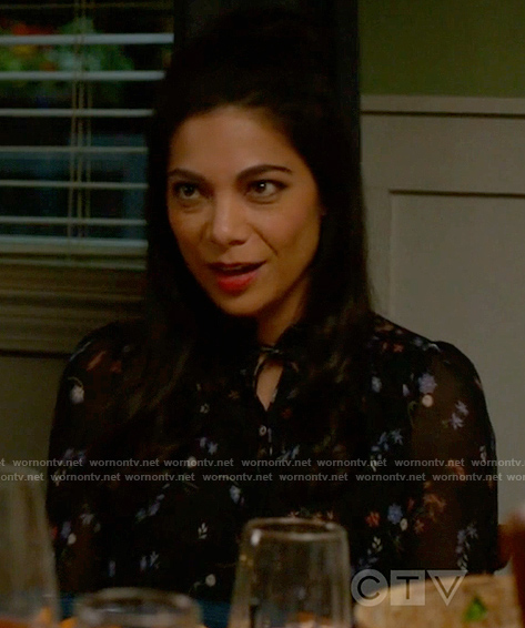 Helen's black floral blouse on True Lies