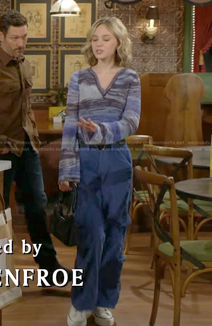 Lucy's blue striped v-neck sweater and blue cargo pants on The Young and the Restless