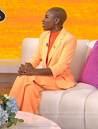 Luvvie Ajayi's orange ruched blazer and pants by Today
