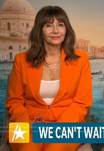 Mary Steenburgen's orange chain detail blazer on Access Hollywood