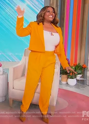 Sherri's orange cropped blazer on Sherri