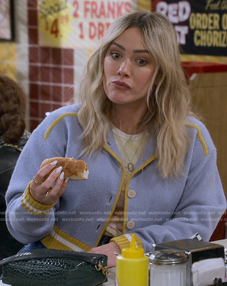 Sophie's blue cropped jacket with yellow trims on How I Met Your Father