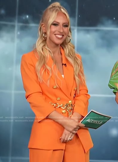 Sydney Sadick's orange blazer with gold buttons on Access Hollywood