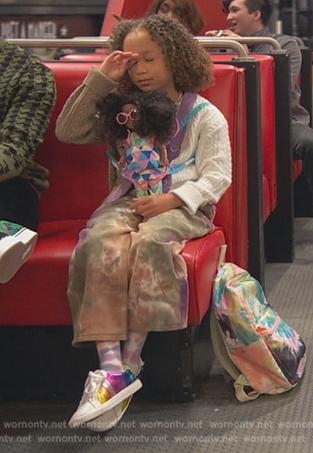 Alice's metallic rainbow stripe sneakers on Ravens Home