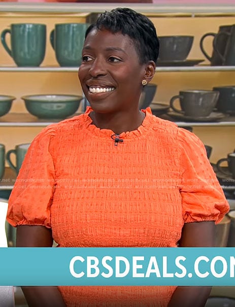 Candi Carter's orange smocked top on CBS Mornings