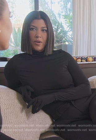 Kourtney's black gloved turtleneck top on The Kardashians