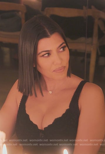 Kourtney's black lace mini dress on The Kardashians
