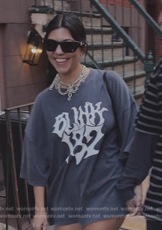 Kourtney's Blink 182 print tee and heart bag on The Kardashians