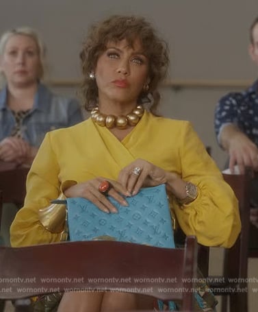 Lisa's turquoise monogram bag on And Just Like That