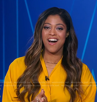 Morgan Norwood's orange blouse and skirt on Good Morning America