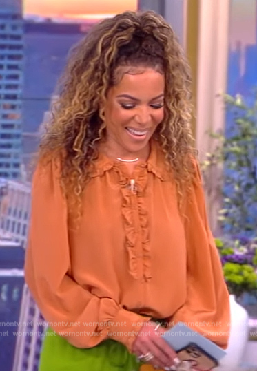 Sunny's ruffle trim blouse and floral pants on The View