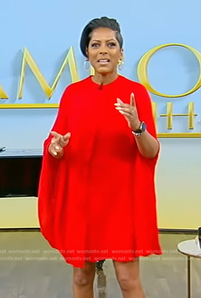 Tamron's red pleated cape dress on Tamron Hall Show