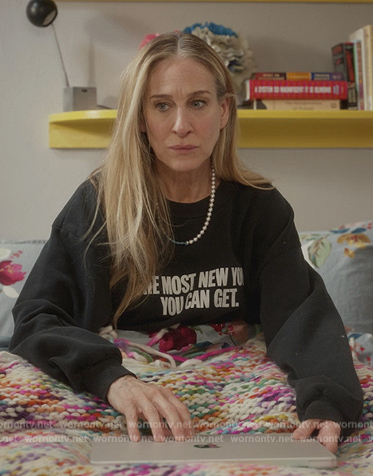 Carrie's multicolored knit wrap on And Just Like That