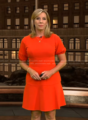 Jacqui Jeras's red puff sleeve flare dress on CBS Evening News