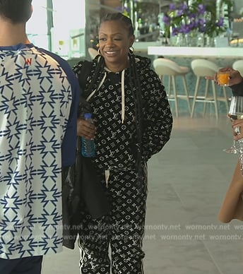 Kandi's black monogram logo hoodie and pants on The Real Housewives of Atlanta