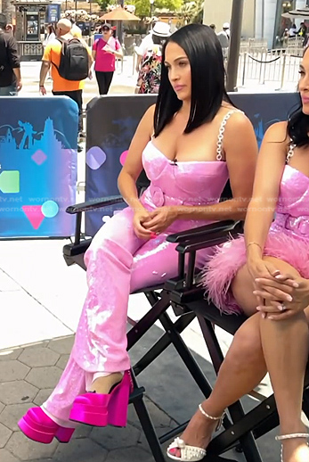 Nikki Garcia's pink metallic jumpsuit on E! News