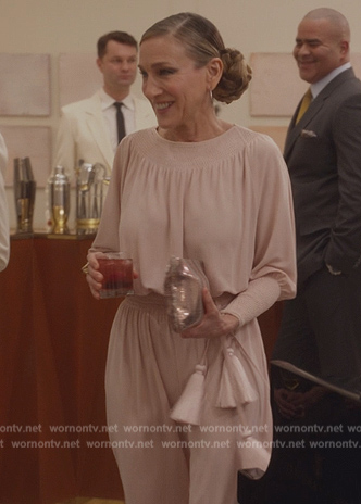 Carrie's pink tassel tie jumpsuit on And Just Like That