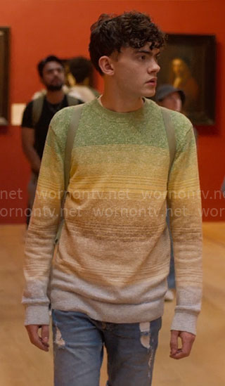 Charlie's ombre sweater, green backpack, and yellow sneakers on Heartstopper